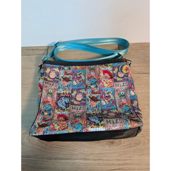 Disney Parks Store Pixar Crossbody Seatbelt Bag by Harveys 2024 Blue Characters - Picture 1 of 9